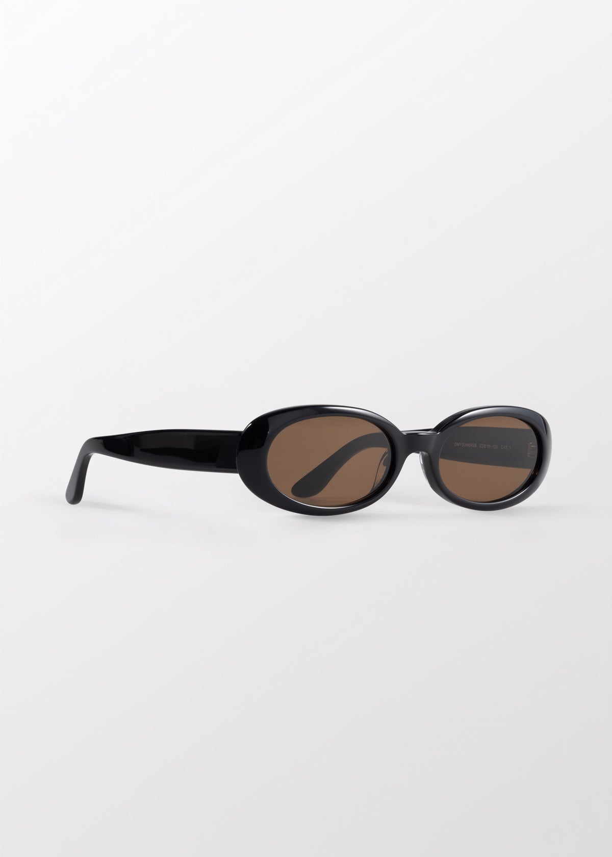 Valentina Black Sunglasses by DMY Studios with brown tinted lenses.