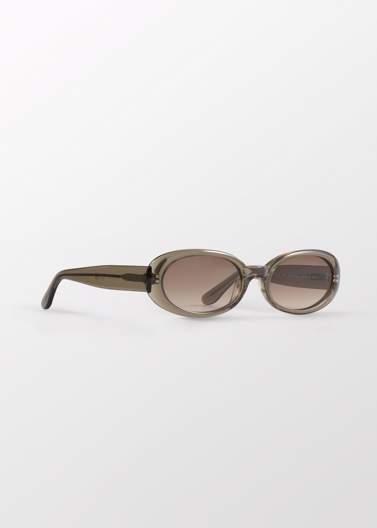 Valentina Olive Oval Sunglasses by DMY Studios with brown tinted lenses.